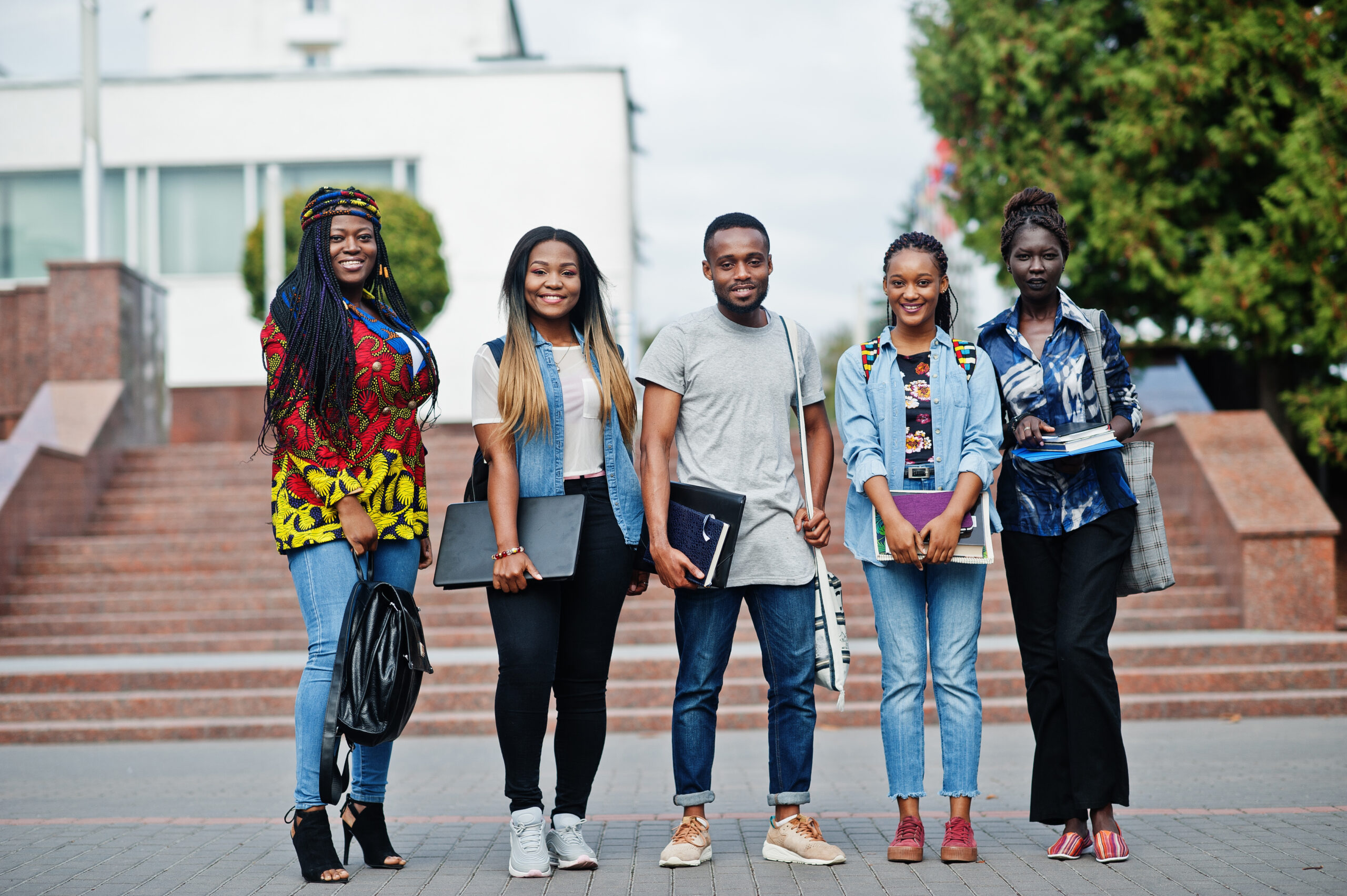 Post Graduate Diploma Education group of five african college students spending time together on